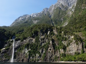 One of the temporary waterfalls at Milford Sound and a geographic fault in the mountain face. 