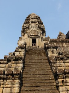 Steps up towards one of the towers at Angkor Wat. The steps are shallow and very steep resulting in a slow ascent, with a bowed head, to show reverence. 